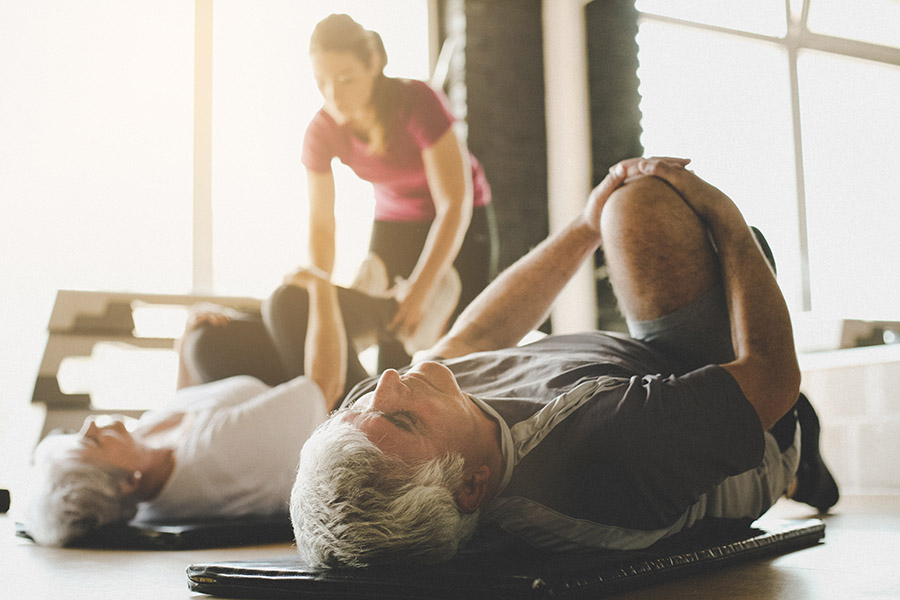 An older couple exercising together to stay in good physical condition.